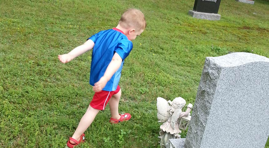 Boy at cemetery